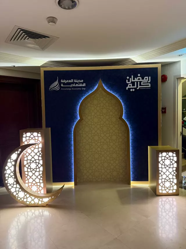 Ramadan backdrop with illuminated crescent and lanterns for Knowledge Economic City