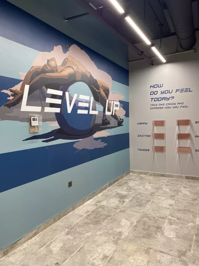 Level Up wall mural in a gym interior